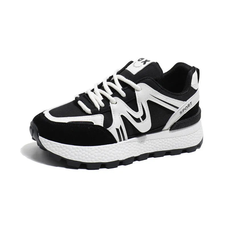 Women's black platform casual sneakers with round toe and front lace-up, showing artificial PU upper and flat sole.