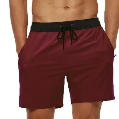 Men's blue athletic shorts with stitching waistband headband pocket and drawstring closure