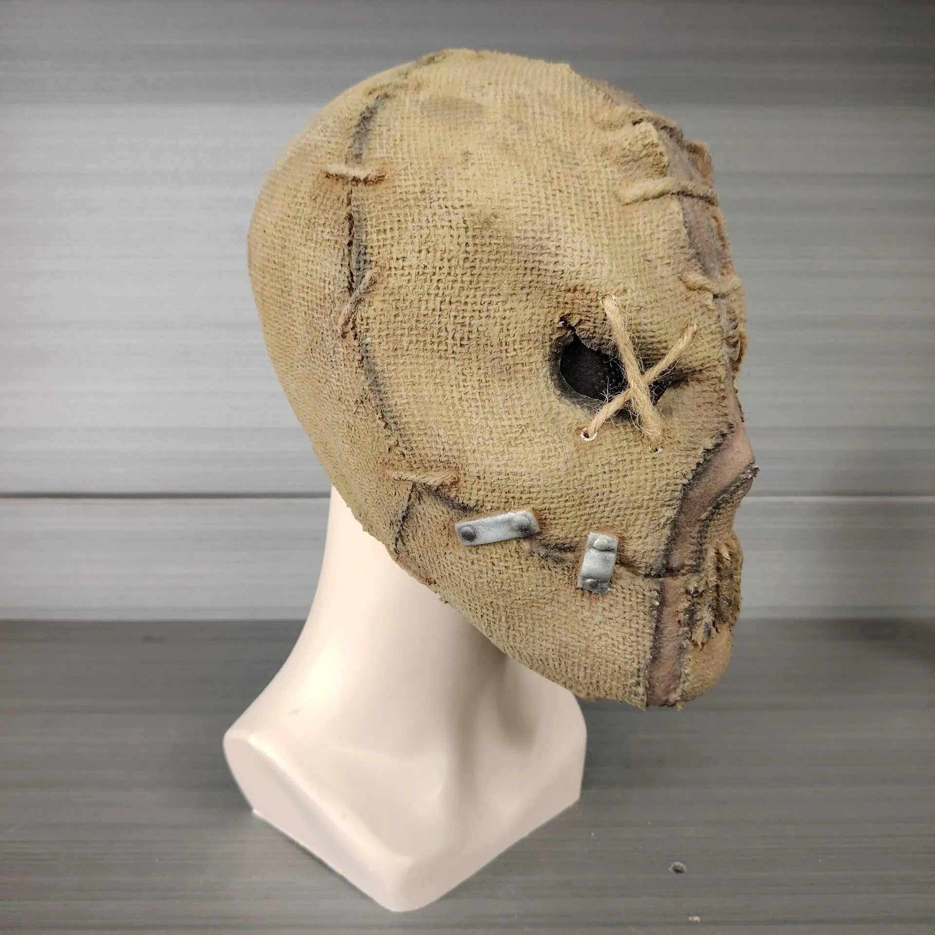 Latex horror head cover with detailed scar skull modelling measuring 31cm tall