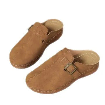 Women's casual wedge slippers in light brown with cloth upper and rubber sole, shown on a foot.