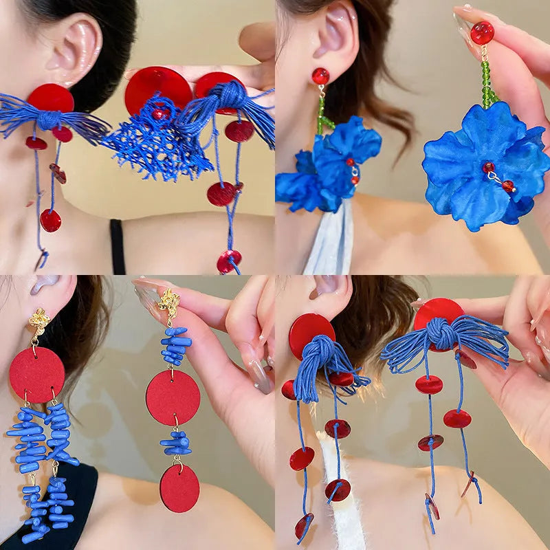 Geometric cloth women's earrings in 30 Silver Needle colour with blue resin flower detailing