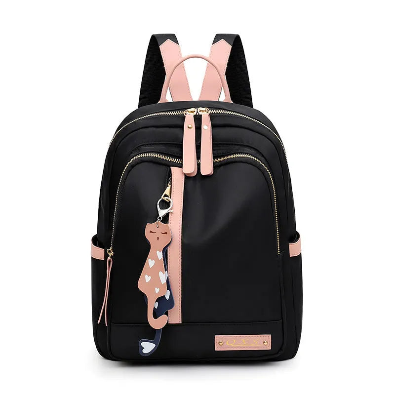 Women's casual nylon backpack in black or pink with water-resistant features and internal organisation compartments