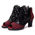 Women's black gladiator sandals with flower lace detailing, square heels, and zip closure