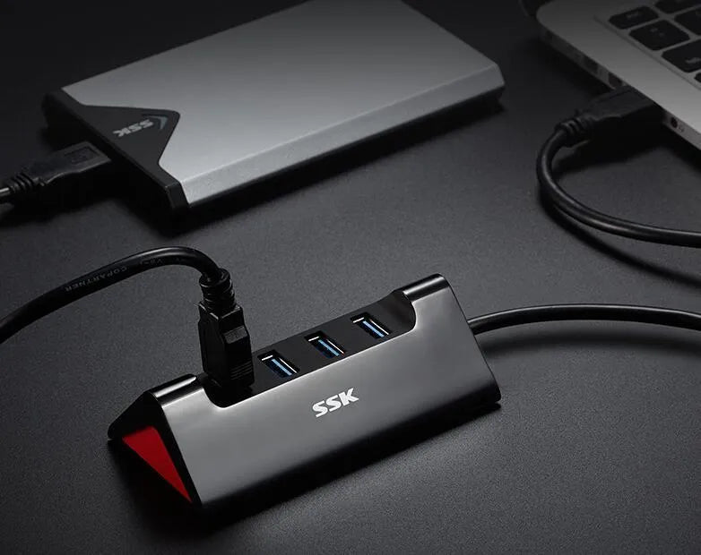 Black USB expansion dock with four USB ports and Micro USB power connection