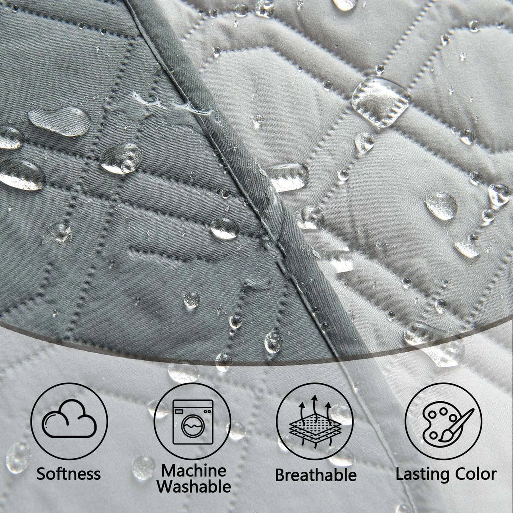 Dark grey and light grey double-sided waterproof dog cushion on a sofa