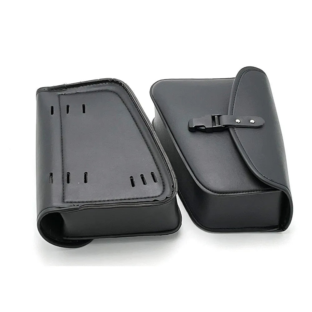 Black PU leather motorcycle swingarm side saddlebag mounted on a Sportster, showing its storage capacity.