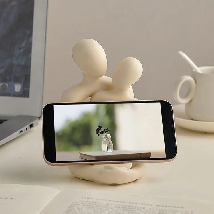 Modern white and gold resin couple statue for shelf or desk decor.