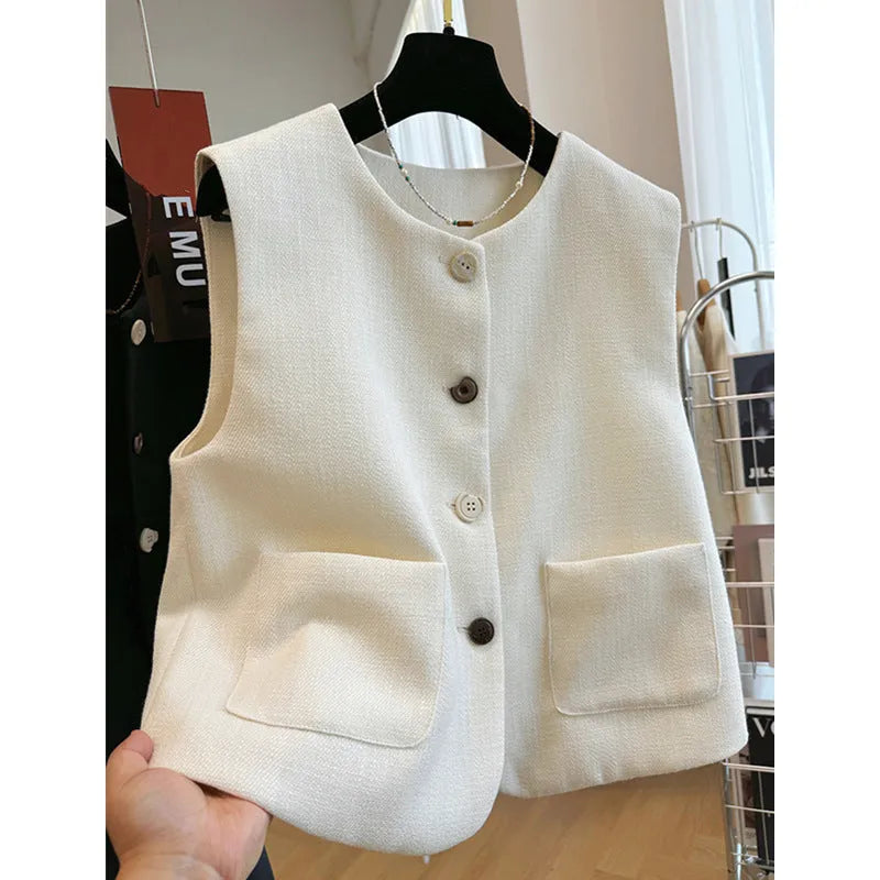 Women's round neck sleeveless vest in milky white, French bandage style, shown front view.