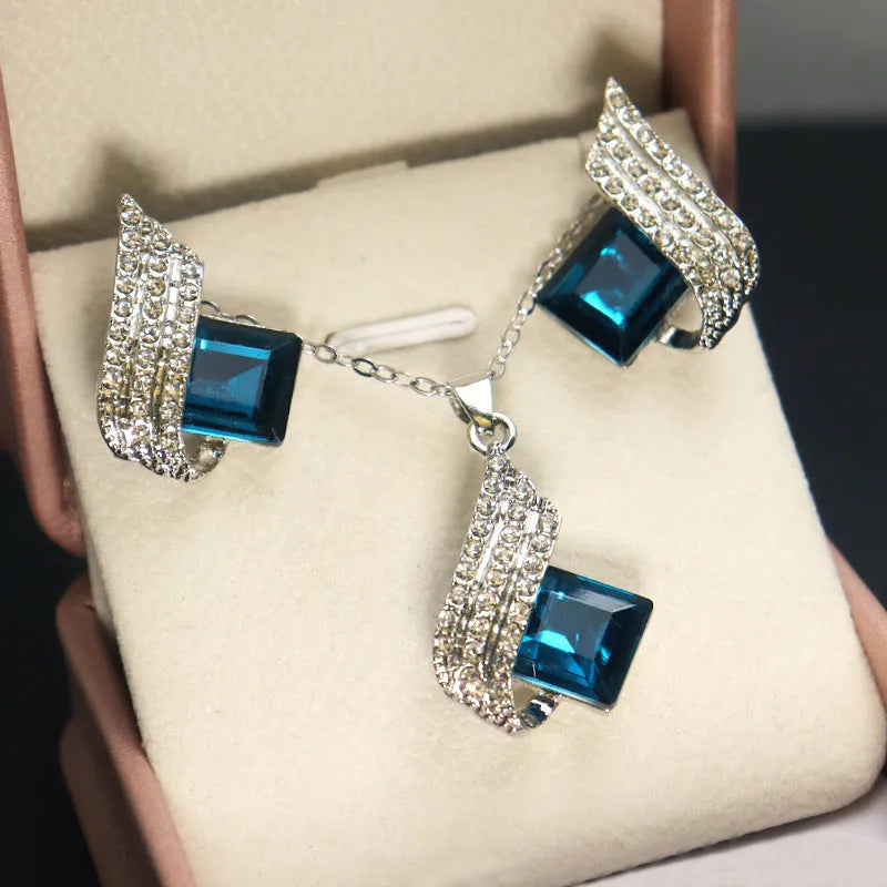 Glass and alloy necklace and earring set with cross chain design and electroplated metallic finish