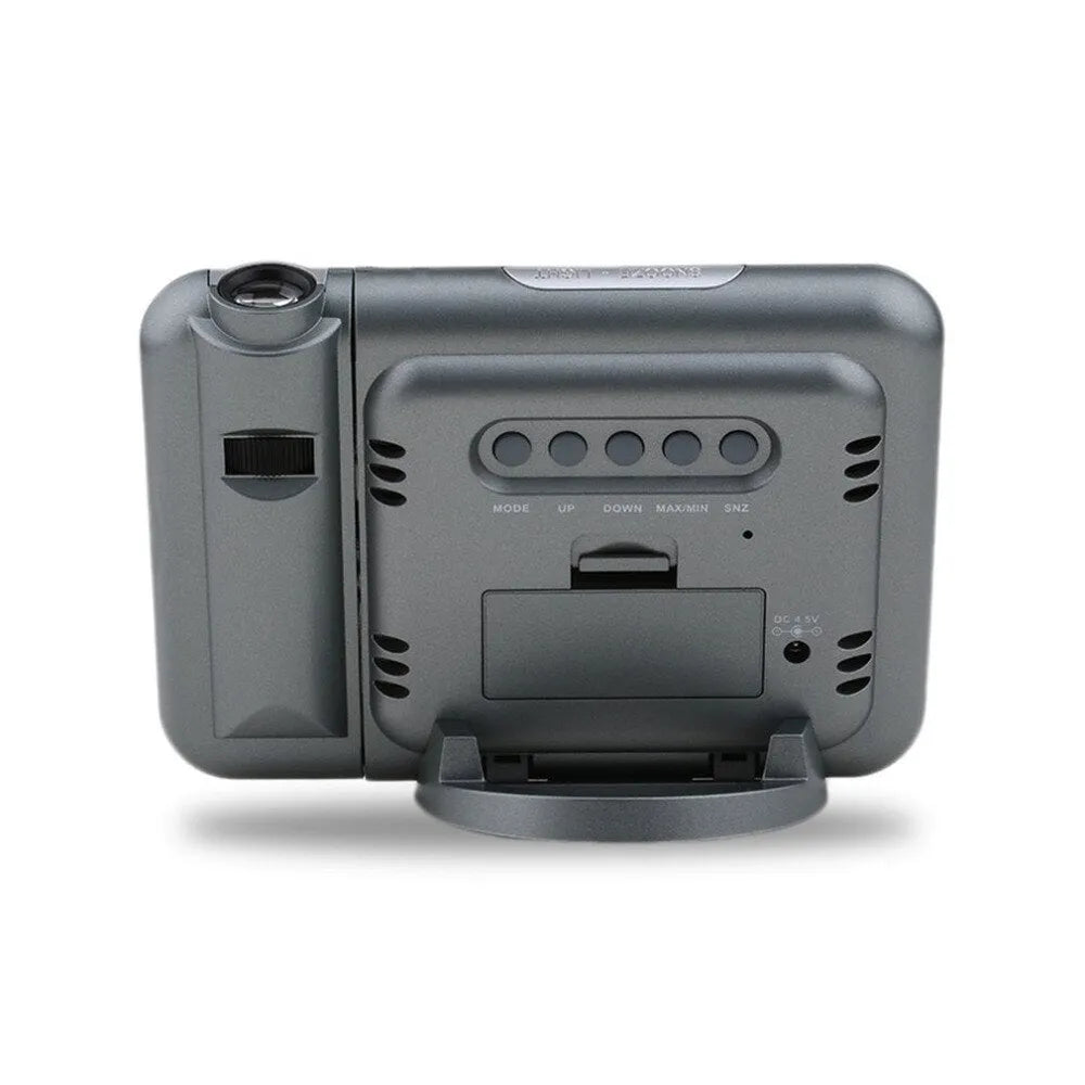 Black hard plastic digital alarm clock with projection feature and display showing time and temperature.