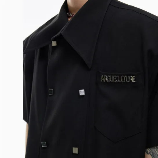 Men's loose fit casual short-sleeved shirt in black with splicing details and metal buttons