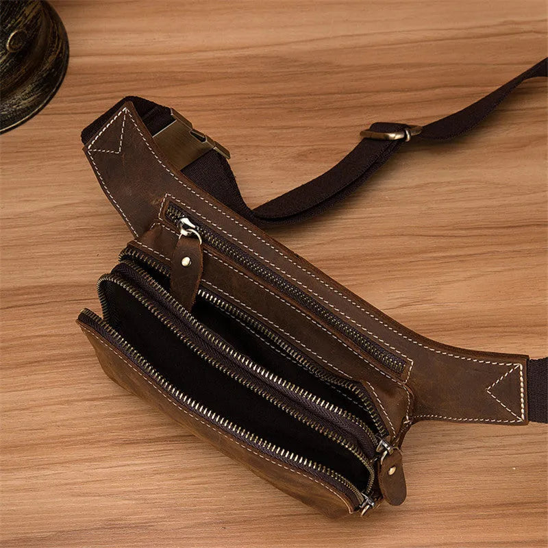 Brown cowhide leather men's sports waist bag with pull closure showing dimensions