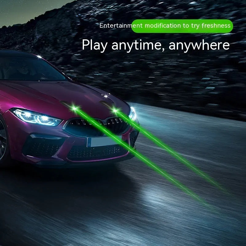Black remote control vehicle strobe light with USB charging cable on a car bumper.