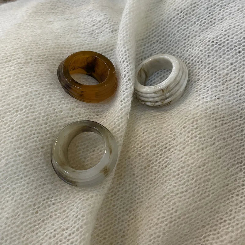 Chinese style geometric resin ring with irregular wide band design in neutral colour