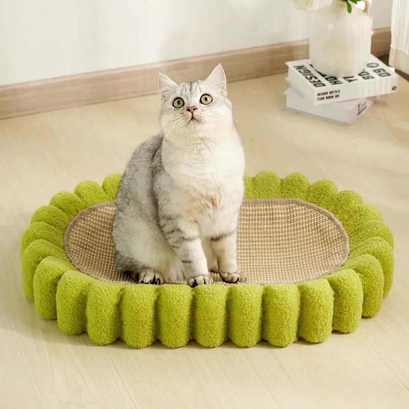 Green oval sisal cat scratching pad serving as a lounging bed with dimensions 650mm by 420mm.