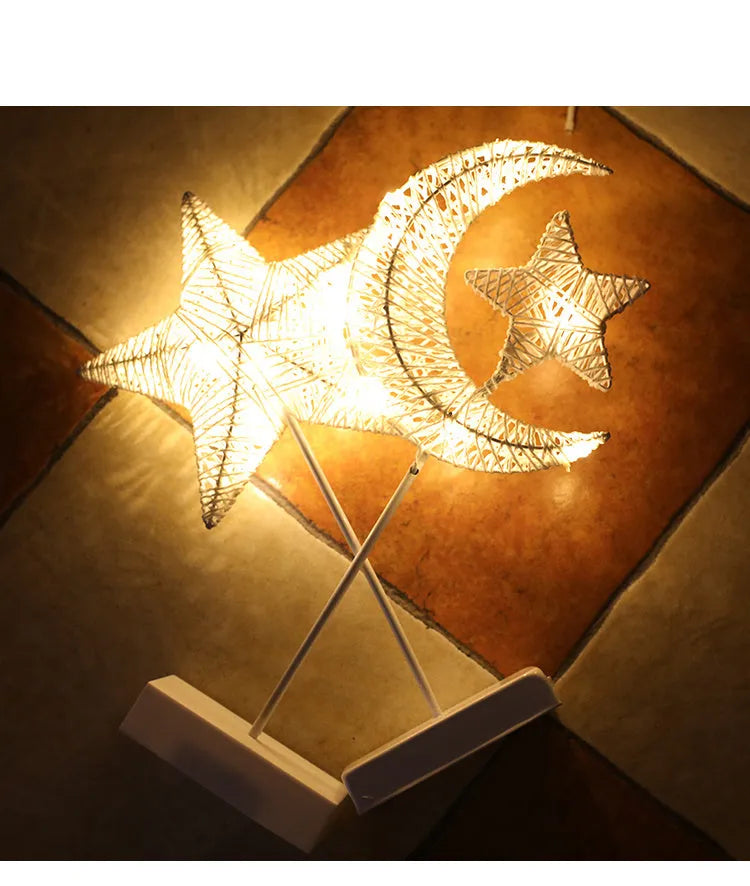 Rattan and PC LED decorative lamp in star, heart, or moon shape on a table.