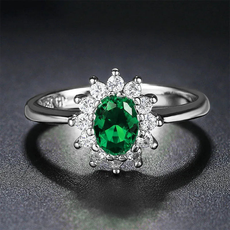 Electroplated copper flower-shaped ring with inlaid blue zirconium stone on a woman's finger.