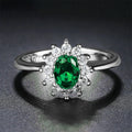 Electroplated copper flower-shaped ring with inlaid blue zirconium stone on a woman's finger.