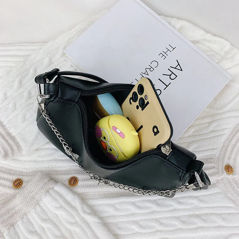 Horizontal square PU crossbody bag with chain strap in retro style showing internal phone and document pockets.