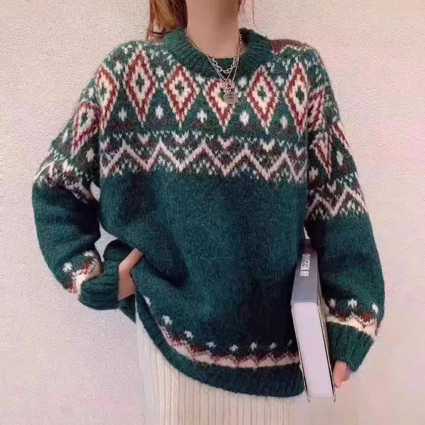 Red and white striped loose fit long sleeve knitted pullover top on a hanger.