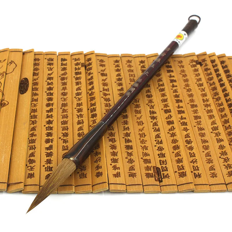Traditional wolf hair calligraphy brush with steel rod handle in large, medium, and small sizes.