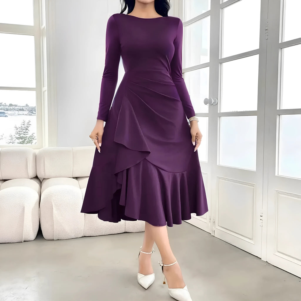 Purple women's long sleeve dress with ruffles and a round neck, showing mid waist fit.