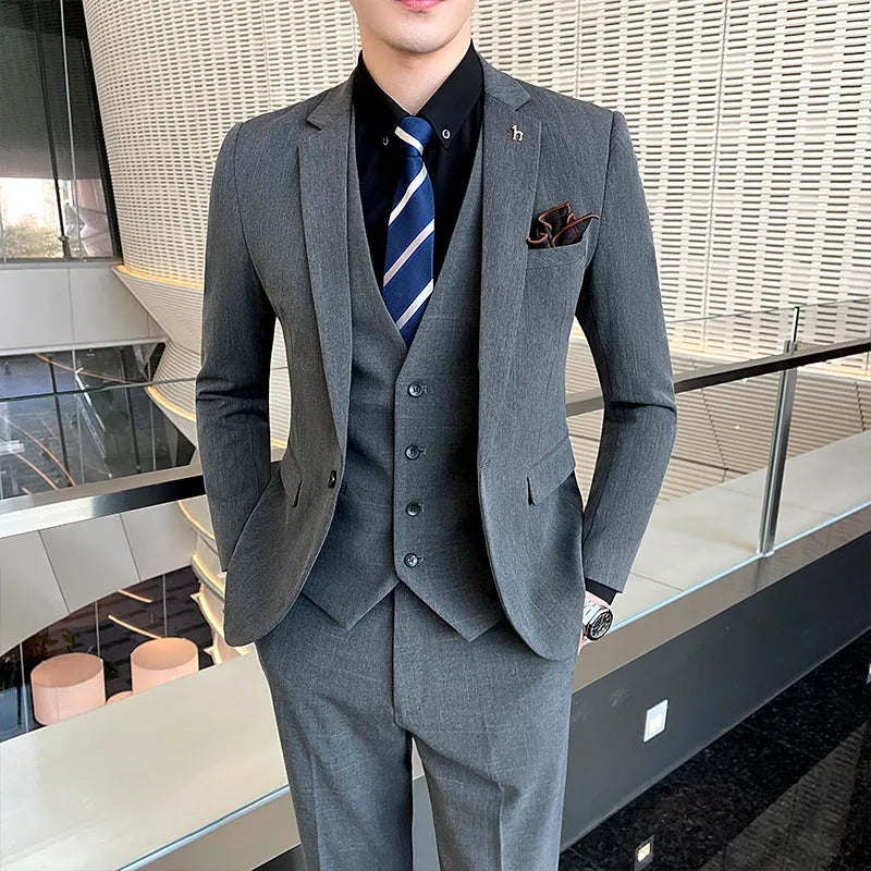 Slim fit men's business suit in black or dark grey cotton blend fabric with adhesive interlining construction
