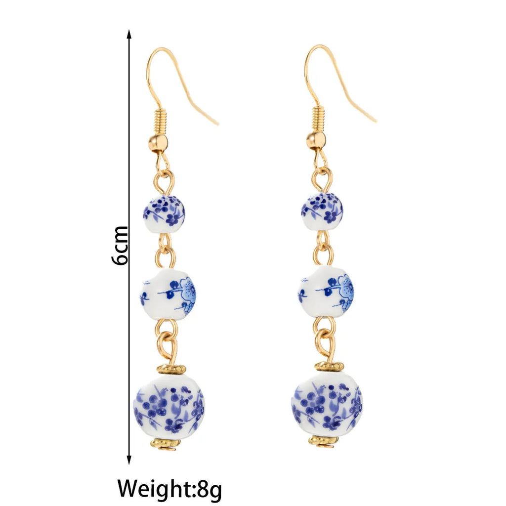 Blue and white porcelain ceramic bead long earrings with geometric alloy elements