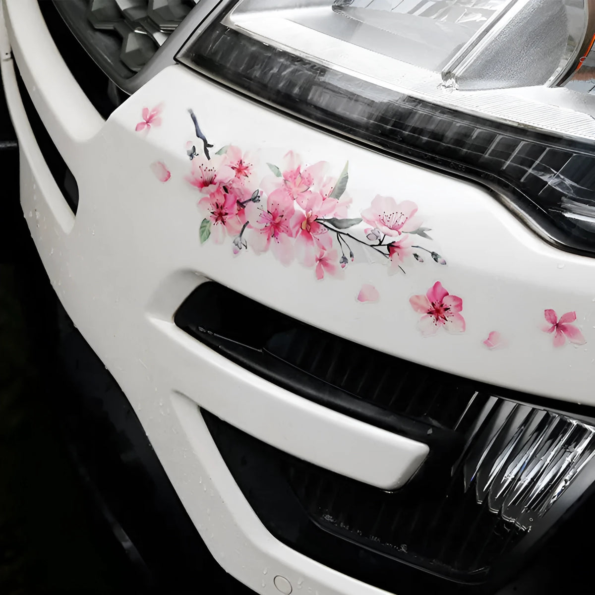 Cherry blossom floral pattern car sticker on a vehicle door, shown in two size options.