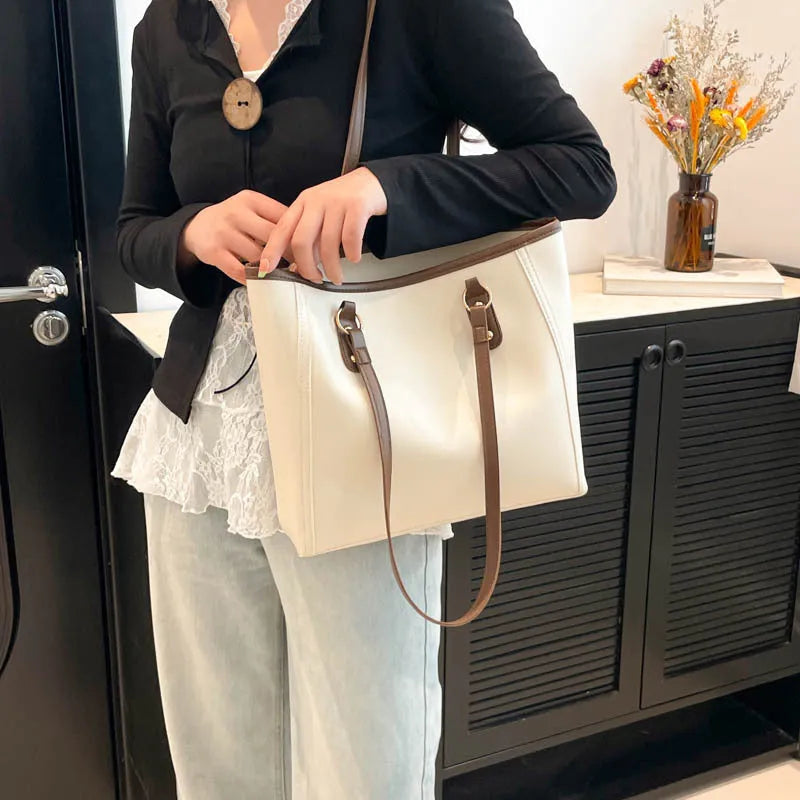 Contrast colour PU leather tote bag showing internal organisation compartments and external slit pocket