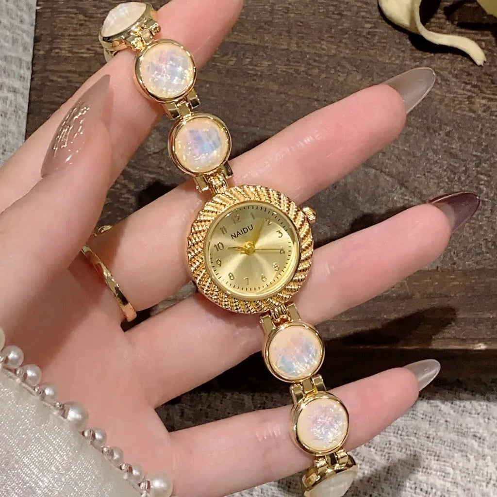 Women's round 25mm quartz watch in milky white with zinc alloy case.