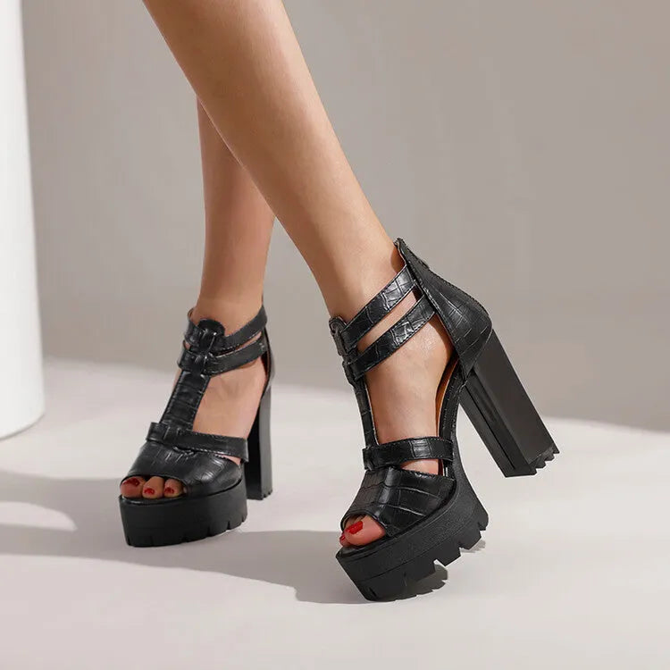 Women's yellow platform high heel sandals with round toe and rear zipper on a rubber sole.