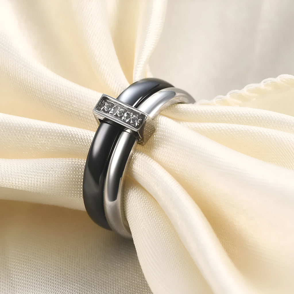 Ceramic women's ring with 6mm band width and inlaid zirconium accents in geometric round design