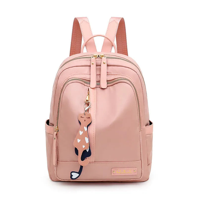 Women's casual nylon backpack in black or pink with water-resistant features and internal organisation compartments