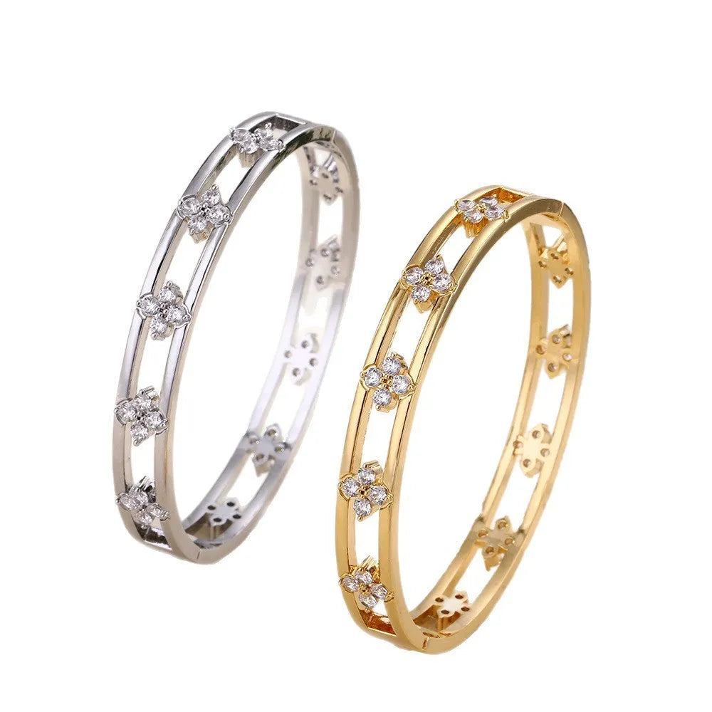 Gold and silver women's hollow bracelets with a four-leaf clover charm and zircon detailing.