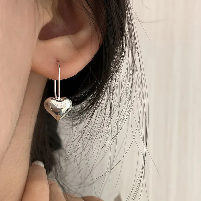 Korean style 3D glossy heart-shaped women's earrings with white gold colour finish