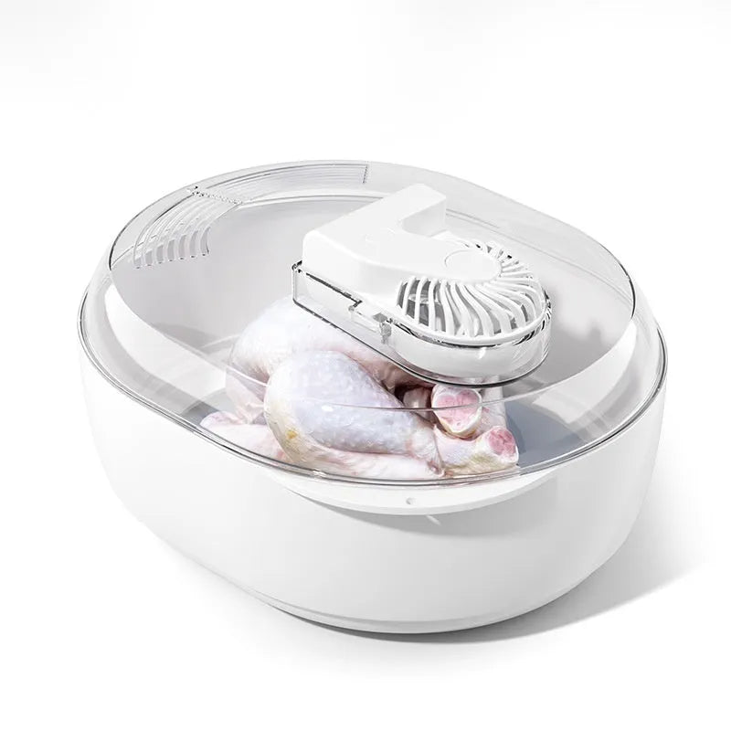 Aluminium household food defrosting plate with USB cable on a kitchen countertop.