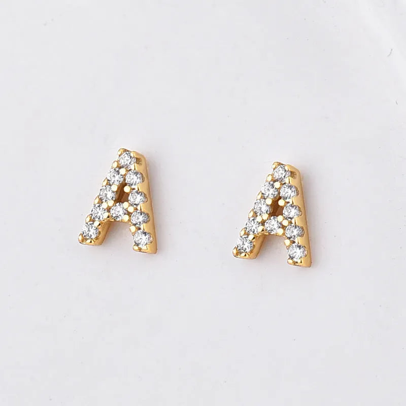Gold plated alphabet letter earrings showing a single 'A' initial with clear zircon stone on a copper base.