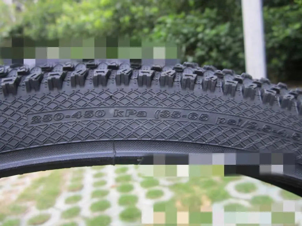 Ultralight puncture-proof mountain bike tyre showing tread pattern and available size options
