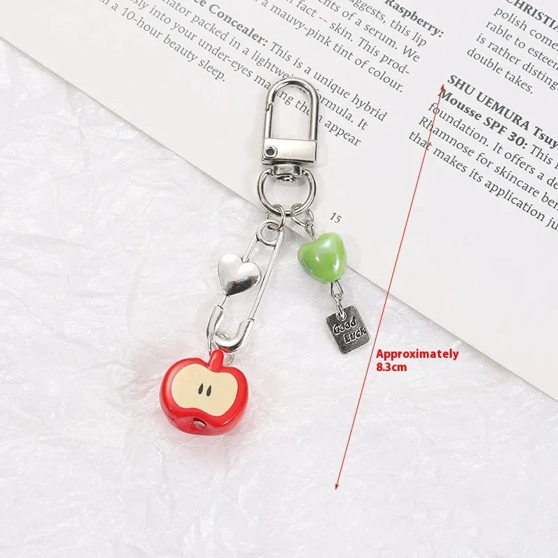Cute fruit design plastic phone charm keychain on a white or silver rope.