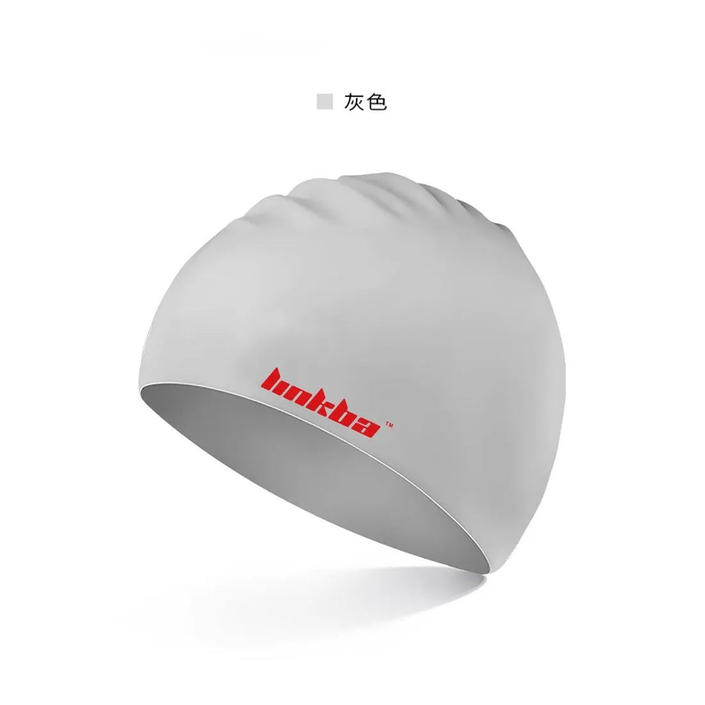 Adult silicone swimming cap with letter pattern in black, shown alongside blue, grey, white, and yellow colour options.
