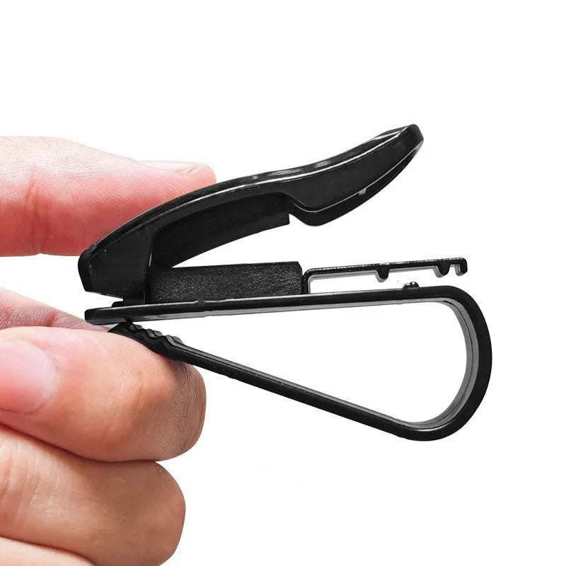 Black plastic car sun visor clip organiser for glasses, tickets and ID cards measuring 6.5 by 2.3 centimetres