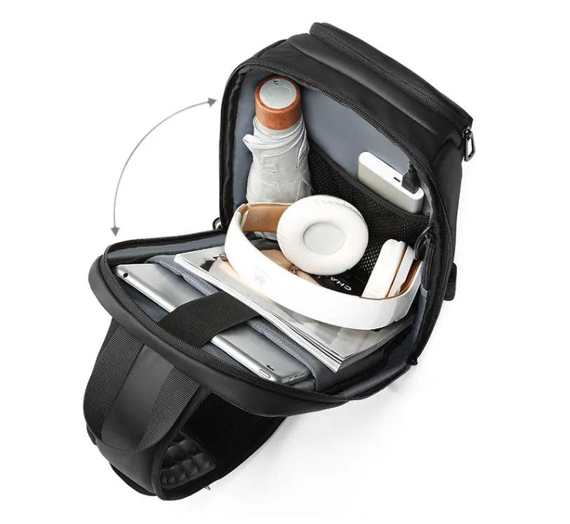 Black medium-sized PVC shoulder bag showing internal organisation pockets and air cushion strap