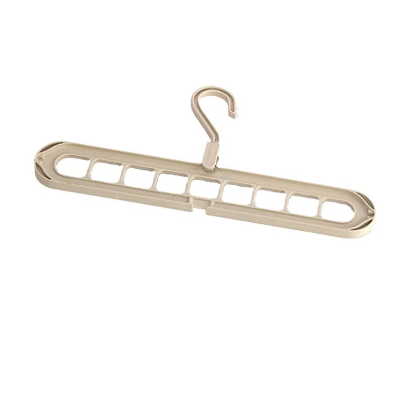 Green plastic nine-hole folding hanger for trousers shown open and folded.