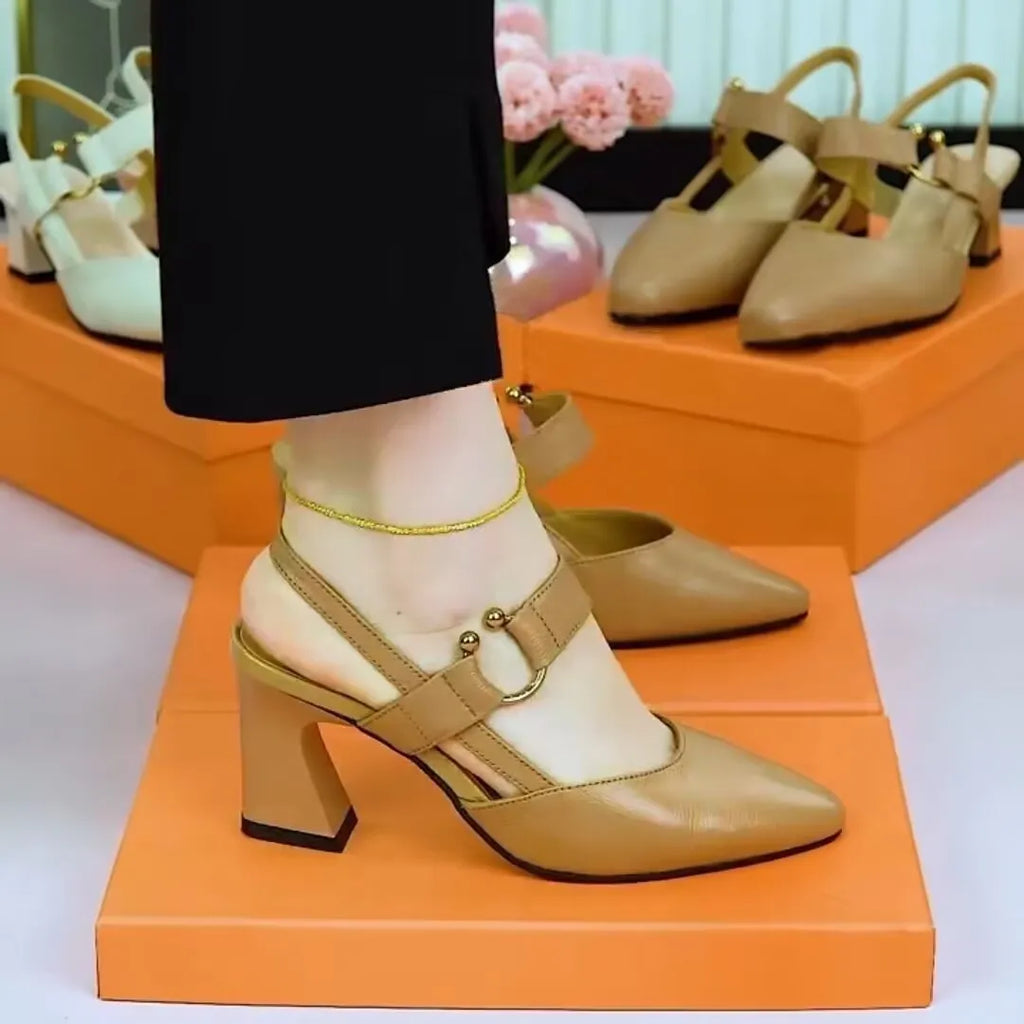 Women's apricot coloured closed toe leather mule sandals with a chunky block heel.
