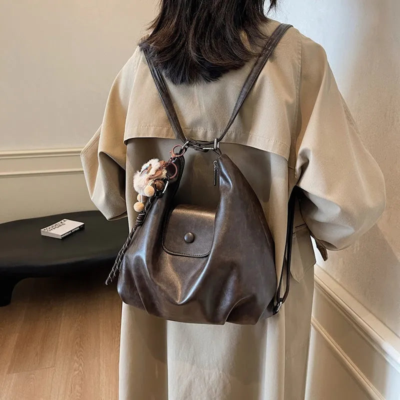 Brown textured PU one-shoulder bag with single strap showing internal phone compartment and horizontal organisation