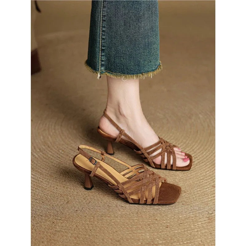 Retro light brown women's sandals with thin cross straps, square toe, ankle buckle, and a mid-height heel.