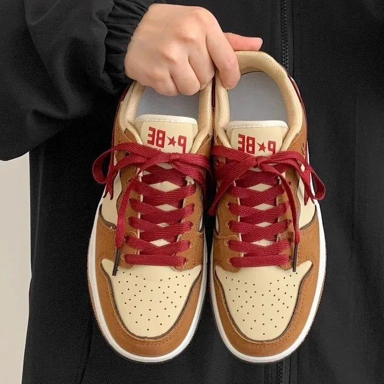 Brown women's low-top platform sneakers with sequin accents and front lace-up closure