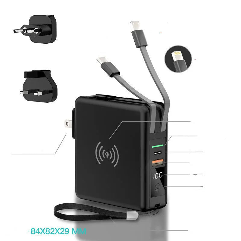 Black and white wireless charging power bank with foldable plug and set of four international travel adapter heads