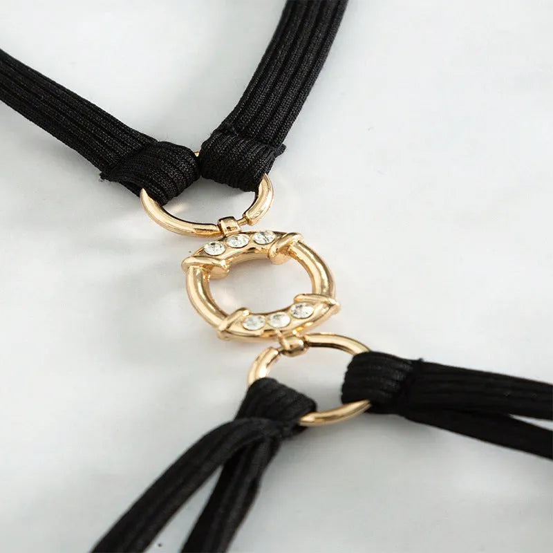 Black women's hollow backless bikini set with triangle top and matching high-waisted swim bottoms